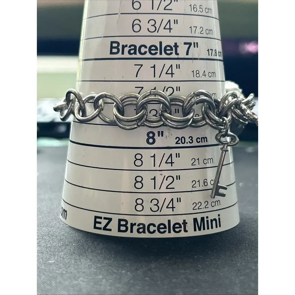 XOXO Silver Tone Key Charms Women’s Quartz Watch